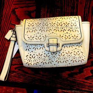 Leather wristlet. Unique designs. Very good condition.